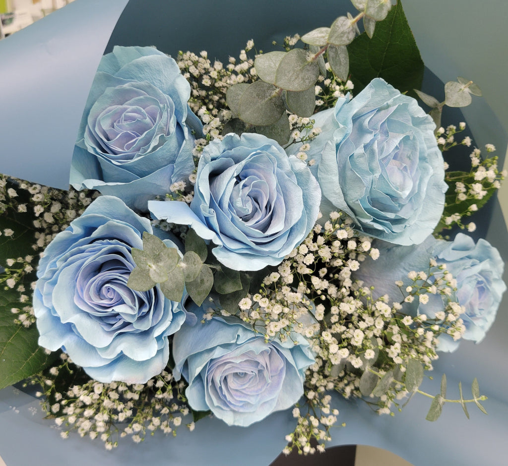 This is baby blue rose bouquet with special rapping. This is the perfect gift for wedding, birthday, any special occation. There are haze grass, eucalyptus and green. We sell these fresh flowers nearby UBC in vancouver. 